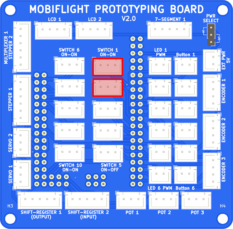 Photo of a prototype board with the two toggle switch connections highlighted.